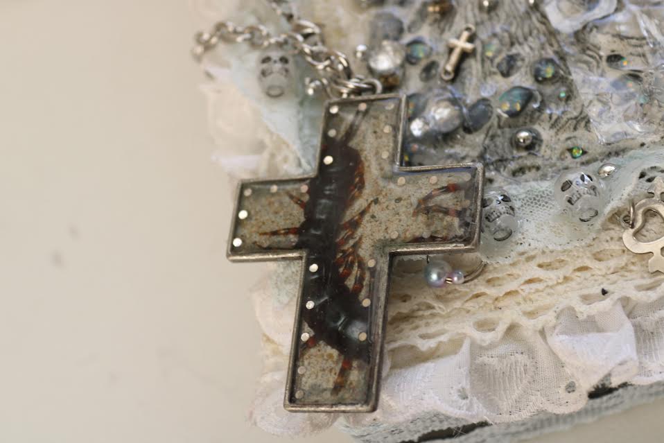 centipede holy cross necklace