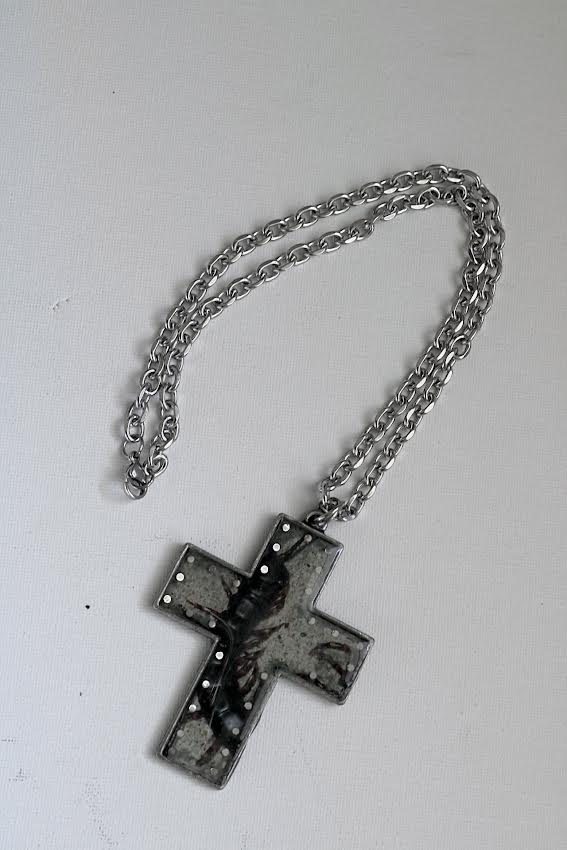 centipede holy cross necklace