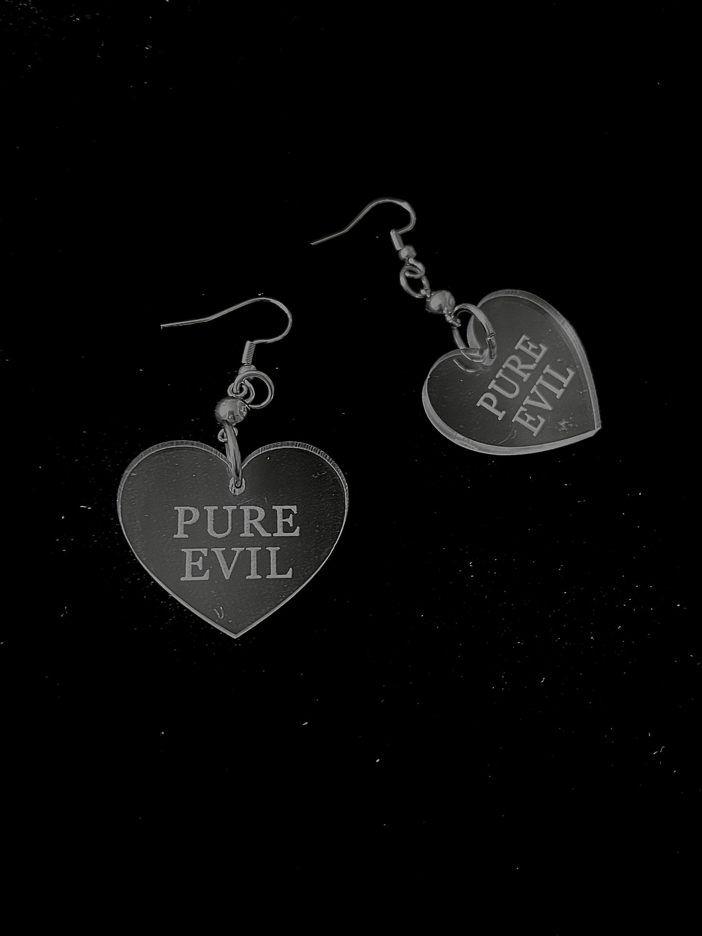 pure evil acrylic heart earrings
